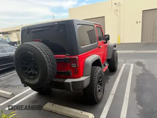 2015 Jeep Wrangler Sport with VIN 1C4AJWAG0FL750098, listed as a IAAI auction lot 41266454 with 77,115 mi miles. Bid and sale history available at carsss.com. Image 4.