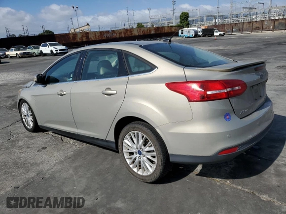 2015 Ford Focus Titanium с VIN 1FADP3J28FL288037, выставлен на аукционе Copart как лот 56972865 с пробегом 75 703 миль миль и Списание • Salvage title. История ставок и продаж доступна на DreamBid. Изображение 2.