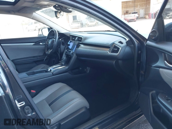 2018 Honda Civic EX-L z VIN JHMFC1F8XJX033602, wystawiony jako IAAI lot #42161015 z przebiegiem 99 597 mil mil oraz . Historia ofert i sprzedaży dostępna na DreamBid. Obrazek 5.