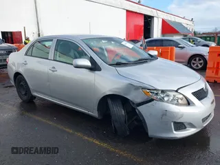 2009 Toyota Corolla with VIN 1NXBU40E39Z131392, listed as a IAAI auction lot 41194018 with 136,031 mi miles. Bid and sale history available at carsss.com. Image 6.