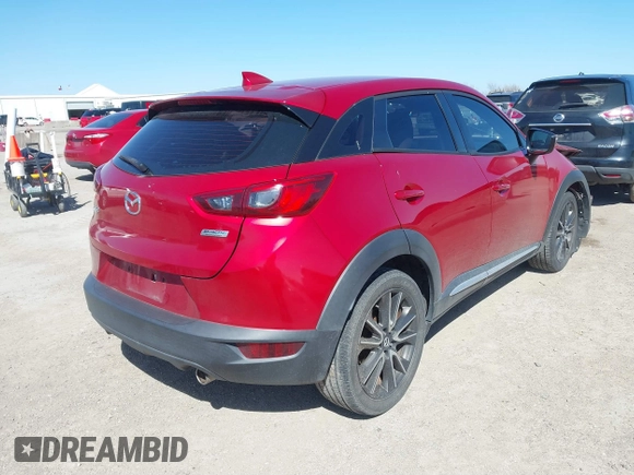 2016 Mazda CX-3 Grand Touring with VIN JM1DKBD71G0112329, listed as a IAAI auction lot 41662610 with 145,329 mi miles. Bid and sale history available at carsss.com. Image 4.