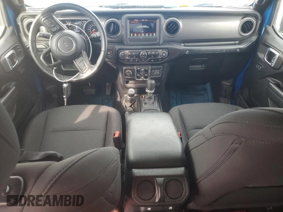 2023 Jeep Wrangler Sport S with VIN 1C4HJXDN5PW573692, listed as a Copart auction lot 42982875 with 25,584 mi miles and Salvage Title. Bid and sale history available at DreamBid. Image 8.