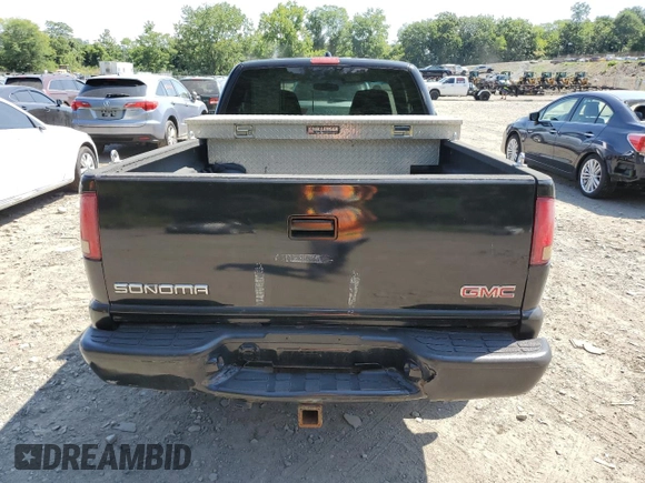 2003 GMC Sonoma SLS z VIN 1GTCT19X738236077, wystawiony jako Copart lot #68765694 z przebiegiem 224 623 mil mil oraz Nie do naprawy • Non repairable. Historia ofert i sprzedaży dostępna na DreamBid. Obrazek 6.