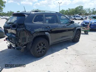 2017 Jeep Cherokee Trailhawk with VIN 1C4PJMBS9HW537962, listed as a IAAI auction lot 42002460 with 129,037 mi miles and . Bid and sale history available at DreamBid. Image 4.