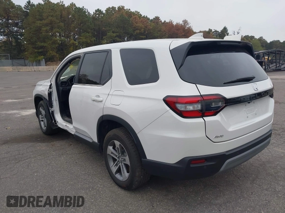 2023 Honda Pilot EX-L with VIN 5FNYG1H58PB016138, listed as a IAAI auction lot 40591717 with 10,068 mi miles and . Bid and sale history available at DreamBid. Image 3.