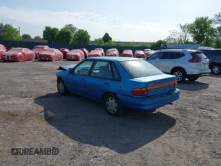 1994 Ford Escort z VIN 1FARP14J1RW244851, wystawiony jako IAAI lot #42157786 z przebiegiem 73 095 mil mil oraz . Historia ofert i sprzedaży dostępna na DreamBid. Obrazek 3.