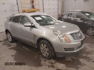 2016 Cadillac SRX Luxury Collection z VIN 3GYFNBE36GS572780, wystawiony jako IAAI lot #41347399 z przebiegiem 166 436 mil mil oraz . Historia ofert i sprzedaży dostępna na DreamBid. Obrazek 1.