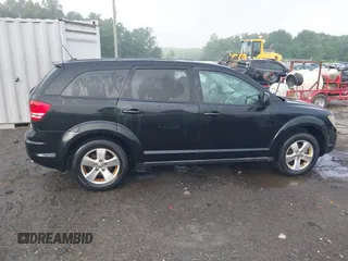 2009 Dodge Journey SXT z VIN 3D4GG57V39T503436, wystawiony jako IAAI lot #42275559 z przebiegiem 136 403 mil mil oraz . Historia ofert i sprzedaży dostępna na DreamBid. Obrazek 13.