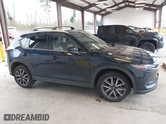 2018 Mazda CX-5 Grand Touring with VIN JM3KFBDM4J0302870, listed as a IAAI auction lot 41934217 with 57,151 mi miles. Bid and sale history available at carsss.com. Image 14.