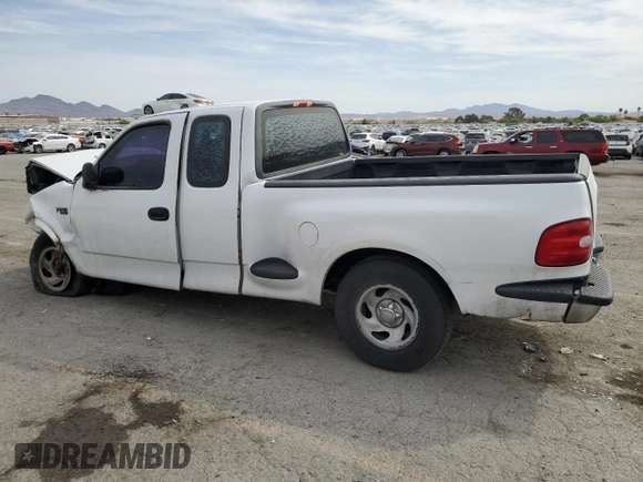 1999 Ford F-150 XL with VIN 1FTZX0721XKA49751, listed as a Copart auction lot 52429195 with Not provided miles and Salvage title. Bid and sale history available at DreamBid. Image 2.