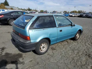 1992 Geo Metro z VIN 2C1MS2465N6782913, wystawiony jako Copart lot #77405574 z przebiegiem 77 080 mil mil oraz Szkody całkowita. Historia ofert i sprzedaży dostępna na DreamBid. Obrazek 3.