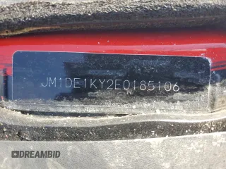 2014 Mazda 2 Sport with VIN JM1DE1KY2E0185106, listed as a Copart auction lot 47486205 with Not Provided miles and Salvage Title. Bid and sale history available at DreamBid. Image 13.