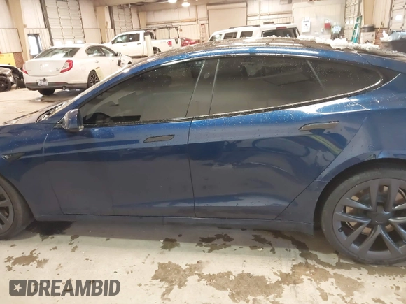 2021 Tesla Model S Plaid with VIN 5YJSA1E6XMF439884, listed as a IAAI auction lot 41622750 with Not provided miles and . Bid and sale history available at DreamBid. Image 14.