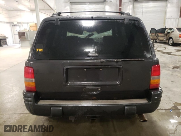 1998 Jeep Grand Cherokee Limited with VIN 1J4GZ88Z3WC165659, listed as a Copart auction lot 87527255 with 203,860 mi miles and Salvage Title. Bid and sale history available at carsss.com. Image 6.