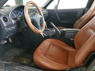 1999 Mazda MX-5 Miata z VIN JM1NB353XX0111850, wystawiony jako Copart lot #53076805 z przebiegiem 128 707 mil mil oraz Szkoda całkowita • Salvage title. Historia ofert i sprzedaży dostępna na DreamBid. Obrazek 7.