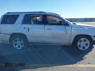 2016 Chevrolet Tahoe LTZ z VIN 1GNSKCKC0GR214110, wystawiony jako IAAI lot #41680822 z przebiegiem 60 271 mil mil oraz . Historia ofert i sprzedaży dostępna na DreamBid. Obrazek 14.