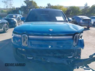 2025 Rivian R1S Adventure with VIN 7PDSGBBA9SN056202, listed as a IAAI auction lot 40766927 with 1,688 mi miles. Bid and sale history available at carsss.com. Image 12.