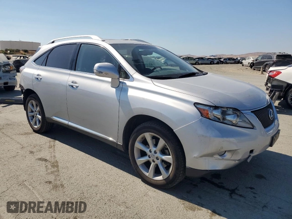 2011 Lexus RX 350 with VIN JTJBK1BA2B2012704, listed as a Copart auction lot 64212805 with 99,079 mi miles and Salvage title. Bid and sale history available at DreamBid. Image 4.