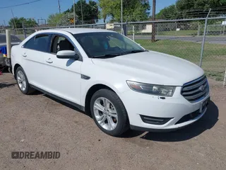 2015 Ford Taurus SEL z VIN 1FAHP2E8XFG196270, wystawiony jako IAAI lot #42007068 z przebiegiem 150 093 mil mil oraz . Historia ofert i sprzedaży dostępna na DreamBid. Obrazek 1.