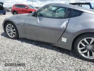 2014 Nissan 370Z with VIN JN1AZ4EH6EM633797, listed as a Copart auction lot 74027354 with Not Provided miles and Salvage Title. Bid and sale history available at DreamBid. Image 12.