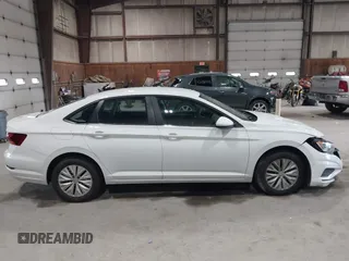 2019 Volkswagen Jetta S z VIN 3VWC57BU6KM129512, wystawiony jako IAAI lot #42205228 z przebiegiem 92 940 mil mil oraz . Historia ofert i sprzedaży dostępna na DreamBid. Obrazek 12.