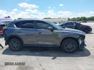 2020 Mazda CX-5 Touring with VIN JM3KFACM9L0826742, listed as a IAAI auction lot 41903755 with 73,409 mi miles and . Bid and sale history available at DreamBid. Image 14.