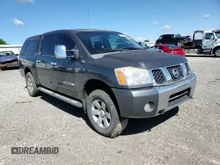 2005 Nissan Titan LE with VIN 1N6BA07B95N571880, listed as a Copart auction lot 57527435 with 199,577 mi miles and Salvage title. Bid and sale history available at DreamBid. Image 13.