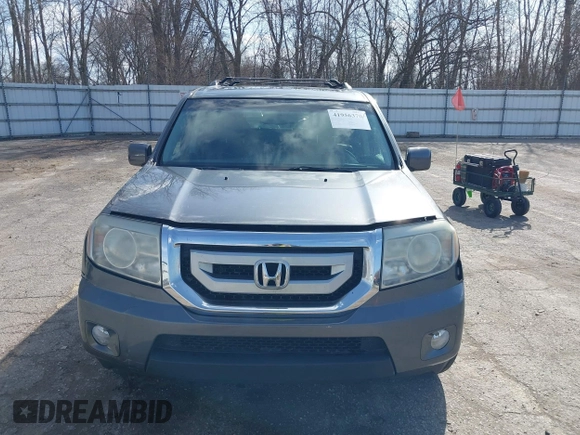 2011 Honda Pilot EX-L with VIN 5FNYF4H51BB065906, listed as a IAAI auction lot 41956370 with 233,977 mi miles and . Bid and sale history available at DreamBid. Image 12.