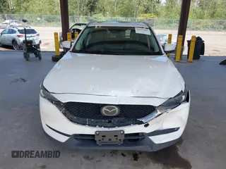 2020 Mazda CX-5 Grand Touring with VIN JM3KFBDM2L0863944, listed as a IAAI auction lot 42150805 with 63,932 mi miles and . Bid and sale history available at DreamBid. Image 12.