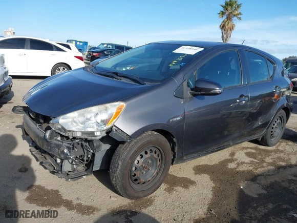 2012 Toyota Prius c One with VIN JTDKDTB34C1019896, listed as a IAAI auction lot 41938946 with 155,804 mi miles. Bid and sale history available at carsss.com. Image 2.