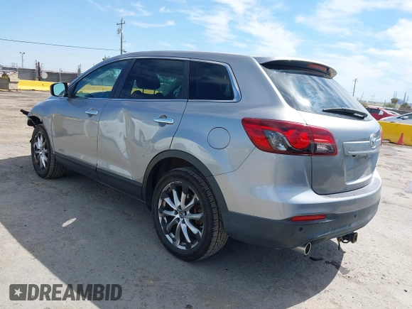 2014 Mazda CX-9 Grand Touring z VIN JM3TB2DVXE0432991, wystawiony jako IAAI lot #42826784 z przebiegiem 134 265 mil mil oraz . Historia ofert i sprzedaży dostępna na DreamBid. Obrazek 3.