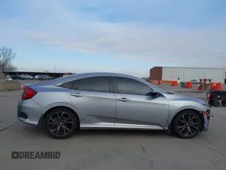 2019 Honda Civic Sport with VIN 19XFC2F8XKE015898, listed as a IAAI auction lot 41431062 with 108,071 mi miles and . Bid and sale history available at DreamBid. Image 13.