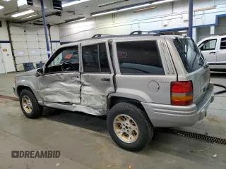 1998 Jeep Grand Cherokee Limited with VIN 1J4GZ78Y3WC216952, listed as a Copart auction lot 83239574 with 186,809 mi miles and Salvage Title. Bid and sale history available at carsss.com. Image 2.