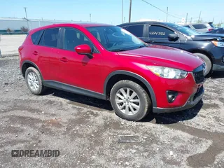 2014 Mazda CX-5 Touring z VIN JM3KE4CY5E0318214, wystawiony jako IAAI lot #42252680 z przebiegiem 102 255 mil mil oraz . Historia ofert i sprzedaży dostępna na DreamBid. Obrazek 1.