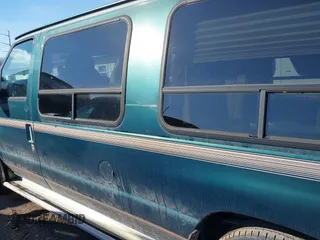 1999 Ford Econoline Cargo with VIN 1FDRE14W3XHB36482, listed as a IAAI auction lot 41393346 with 130,669 mi miles. Bid and sale history available at carsss.com. Image 14.
