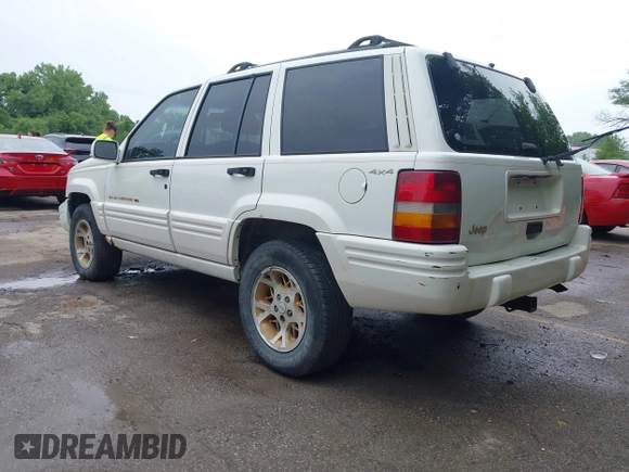 1997 Jeep Grand Cherokee Limited z VIN 1J4GZ78S1VC536295, wystawiony jako IAAI lot #42435292 z przebiegiem 310 005 mil mil oraz . Historia ofert i sprzedaży dostępna na DreamBid. Obrazek 3.