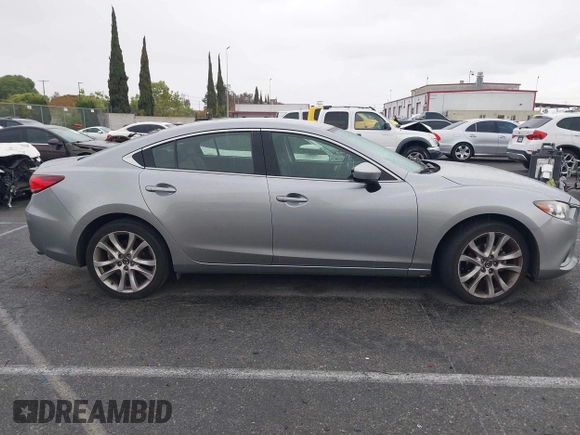 2014 Mazda 6 i Touring with VIN JM1GJ1V60E1141831, listed as a IAAI auction lot 42131200 with 86,597 mi miles and . Bid and sale history available at DreamBid. Image 13.