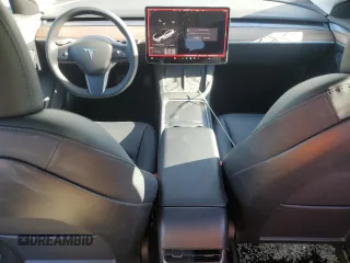 2023 Tesla Model 3 with VIN 5YJ3E1EA1PF556562, listed as a Copart auction lot 48413235 with 11,980 mi miles and Salvage Title. Bid and sale history available at DreamBid. Image 8.