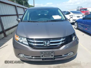 2014 Honda Odyssey Touring with VIN 5FNRL5H99EB075979, listed as a IAAI auction lot 42520154 with 99,314 mi miles and . Bid and sale history available at DreamBid. Image 13.