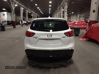 2016 Mazda CX-5 Touring z VIN JM3KE4CY0G0853261, wystawiony jako IAAI lot #41861176 z przebiegiem 63 491 mil mil oraz . Historia ofert i sprzedaży dostępna na DreamBid. Obrazek 16.