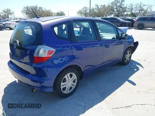 2009 Honda Fit with VIN JHMGE88249S056575, listed as a IAAI auction lot 41702555 with 116,658 mi miles. Bid and sale history available at carsss.com. Image 4.