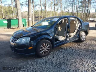 2010 Volkswagen Jetta Sedan Limited with VIN 3VWRX7AJ8AM035447, listed as a IAAI auction lot 41598577 with 146,888 mi miles. Bid and sale history available at carsss.com. Image 2.