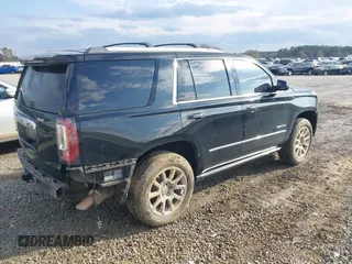 2015 GMC Yukon Denali with VIN 1GKS1CKJ8FR612971, listed as a IAAI auction lot 41519689 with 197,003 mi miles. Bid and sale history available at carsss.com. Image 4.