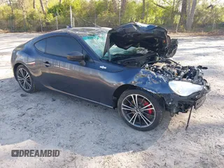 2015 Scion FR-S with VIN JF1ZNAA10F8707671, listed as a IAAI auction lot 42000130 with 136,734 mi miles. Bid and sale history available at carsss.com. Image 1.