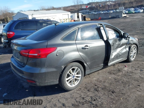 2018 Ford Focus SE z VIN 1FADP3F2XJL295508, wystawiony jako IAAI lot #41608216 z przebiegiem 89 696 mil mil oraz . Historia ofert i sprzedaży dostępna na DreamBid. Obrazek 4.