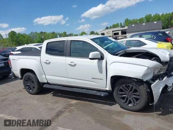2019 GMC Canyon 4WD SLE z VIN 1GTG6CENXK1319647, wystawiony jako IAAI lot #42039568 z przebiegiem 56 371 mil mil oraz . Historia ofert i sprzedaży dostępna na DreamBid. Obrazek 14.
