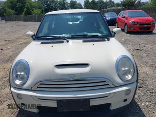 2006 MINI Hardtop S with VIN WMWRE33596TJ37959, listed as a IAAI auction lot 42635457 with 124,440 mi miles and . Bid and sale history available at DreamBid. Image 6.