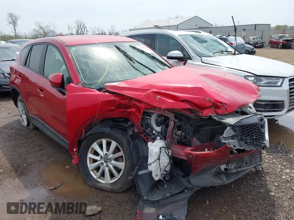 2014 Mazda CX-5 Touring with VIN JM3KE2CY4E0411780, listed as a IAAI auction lot 41903570 with 103,658 mi miles and . Bid and sale history available at DreamBid. Image 1.