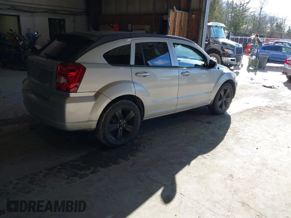 2011 Dodge Caliber Mainstreet with VIN 1B3CB3HA4BD121598, listed as a IAAI auction lot 41202366 with 92,012 mi miles. Bid and sale history available at carsss.com. Image 4.