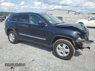 2011 Jeep Grand Cherokee Laredo with VIN 1J4RR4GG7BC515001, listed as a Copart auction lot 56432905 with 143,181 mi miles and Salvage title. Bid and sale history available at DreamBid. Image 4.